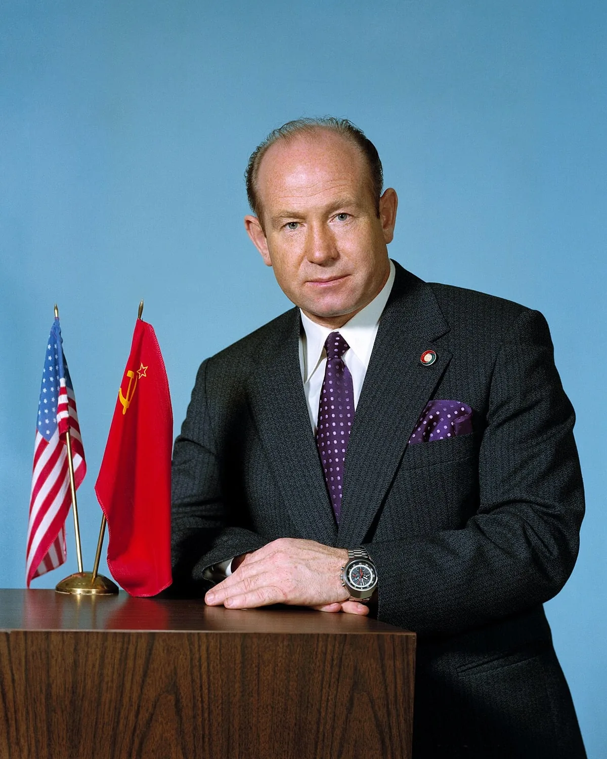 Alexey Leonov seated at a desk in a formal portrait