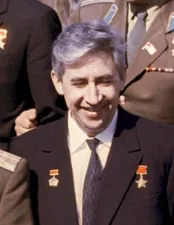 Konstantin Feoktistov in a suit and tie wearing medals
