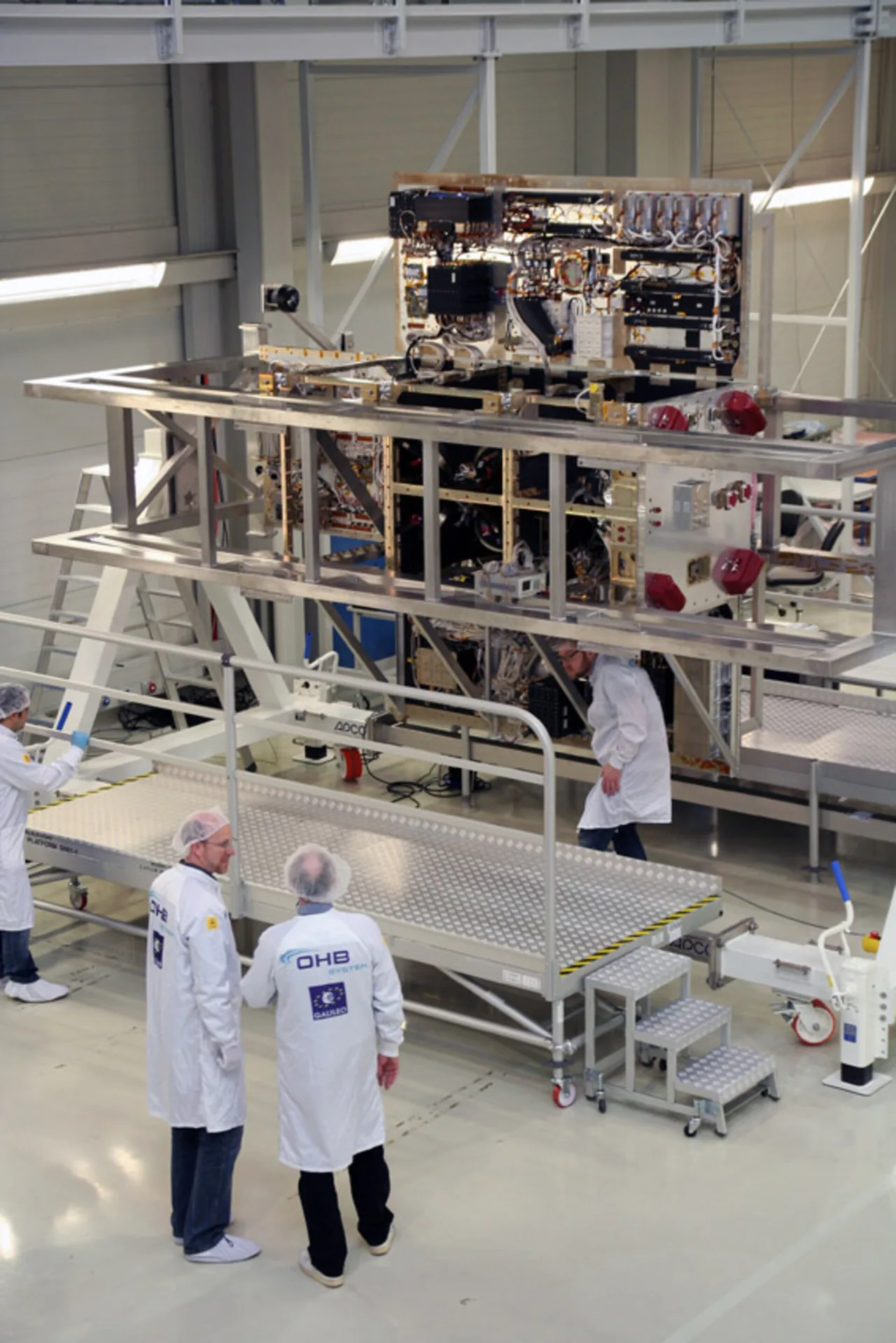 First Galileo FOC navigation spacecraft under assembly in an OHB clean room.