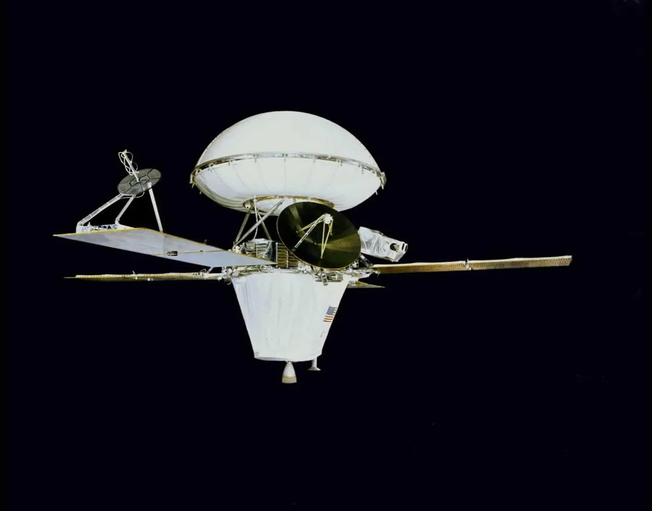 An assembled Viking spacecraft has an enclosed lander, extended solar panels and antennas against a dark background
