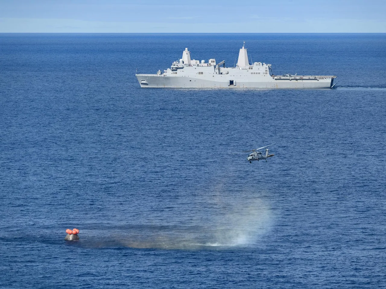 The Artemis I Orion spacecraft floats in the Pacific after splashdown