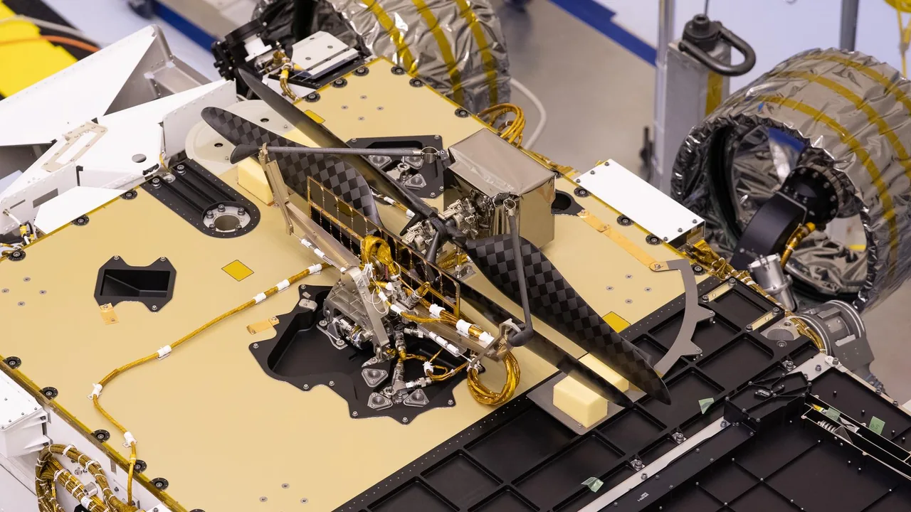 Ingenuity’s small rotors and body are attached beneath Perseverance during ground integration