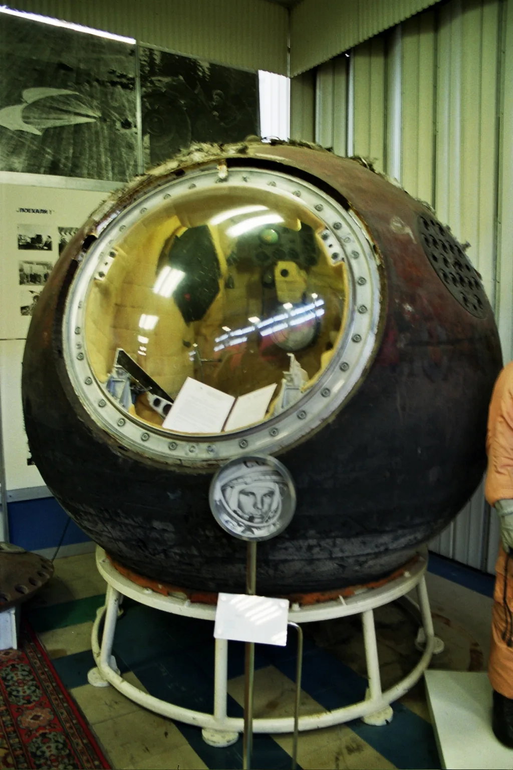 The scorched Vostok 1 descent module stands on display after its recovery