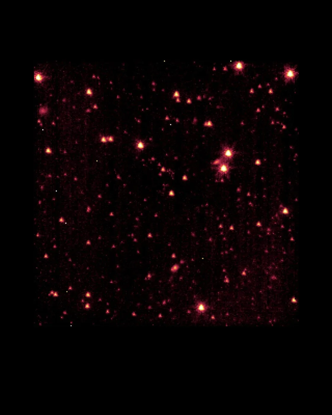 A dark rectangular infrared field contains red, yellow and white points, with several broader sources among them.