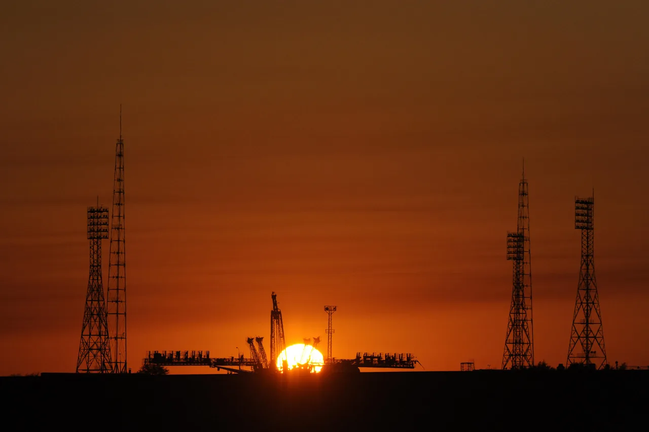 Gagarin's Start launch pad at Baikonur silhouetted against an orange sunrise