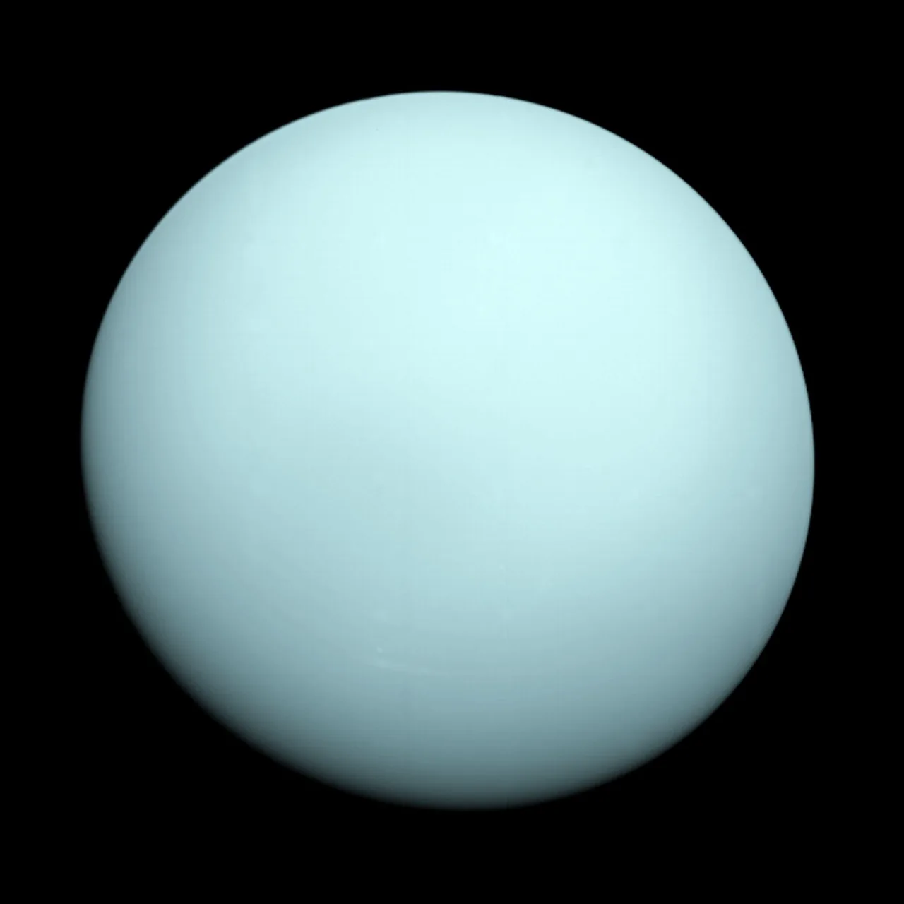 A pale blue-green disk of Uranus has very subtle shading and few clearly resolved cloud features against black space.