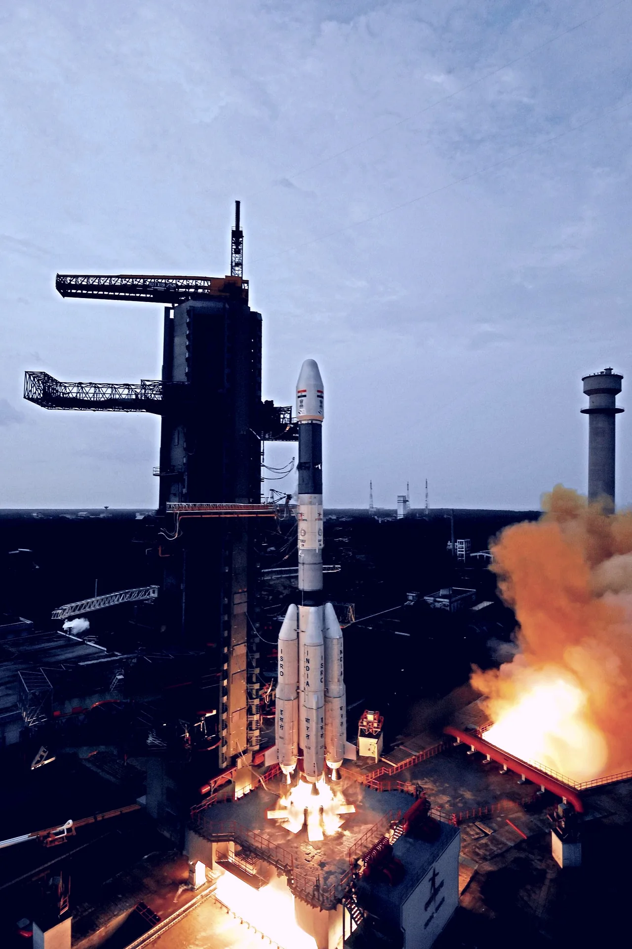 GSLV Mk II D6 rocket carrying GSAT-6 beginning its ascent beside the service tower.
