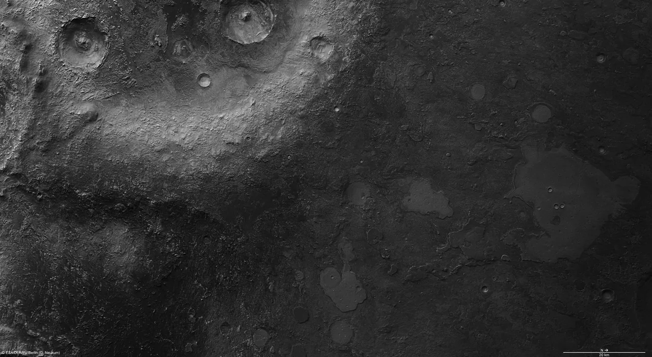 A grayscale orbital view of Arabia Terra shows large craters and rough terrain at left, smoother darker surfaces at right, and a 20-kilometer scale bar with north pointing right.