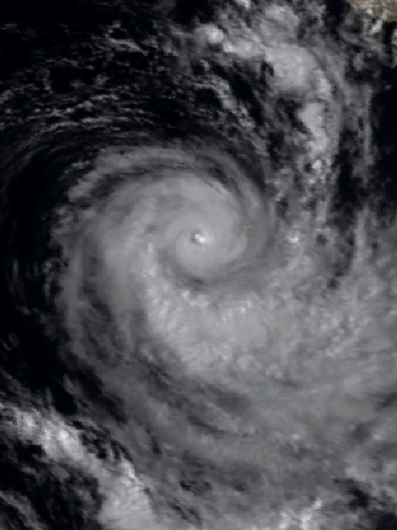 Grayscale Meteosat-2 satellite view of the circular cloud bands and eye of Tropical Cyclone Gista.