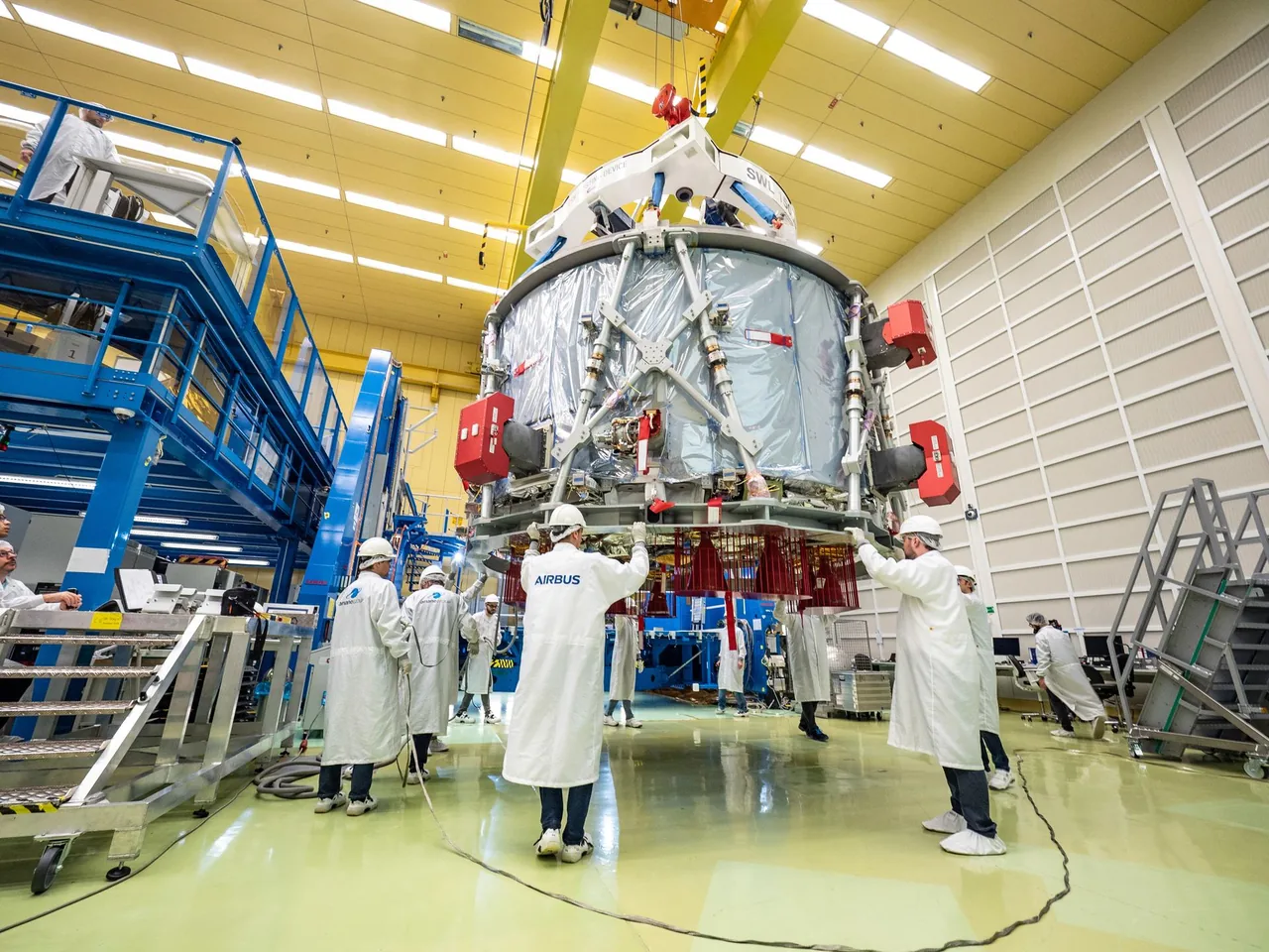 An Orion European Service Module is prepared for integration in a clean processing facility.