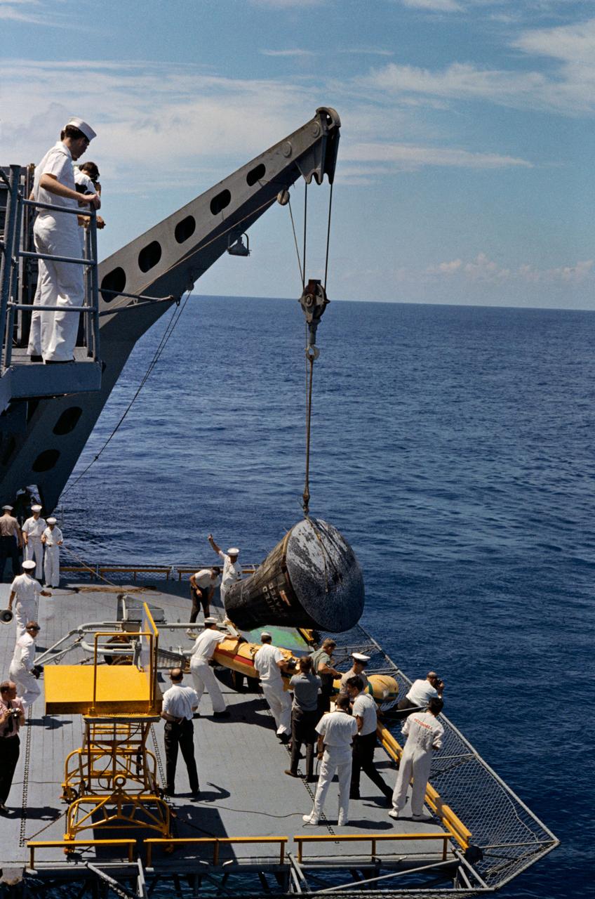 Gemini 5 capsule being brought aboard the USS Lake Champlain after recovery